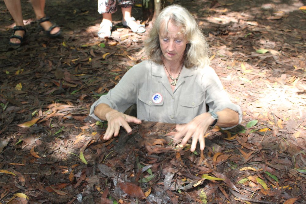 girl inside cu chi tunnels vietnam