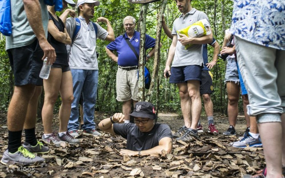 group of people cu chi tunnels vietnam