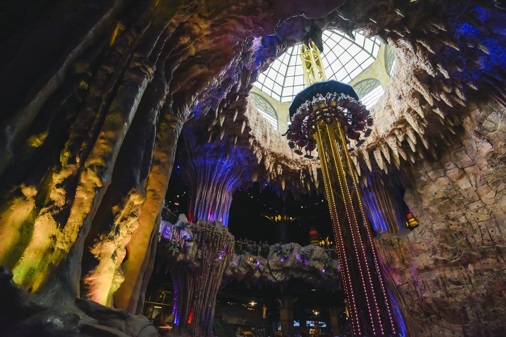 Indoor drop tower ride inside Fantasy Park at Ba Na Hills, Vietnam, with colorful cave-themed design