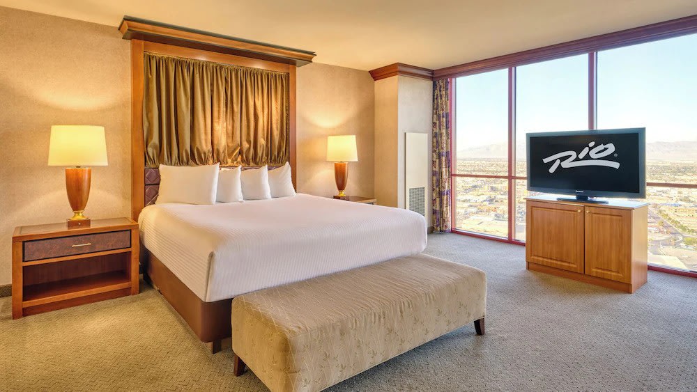 Bright and airy king room at the renovated Rio Hotel with floor-to-ceiling windows