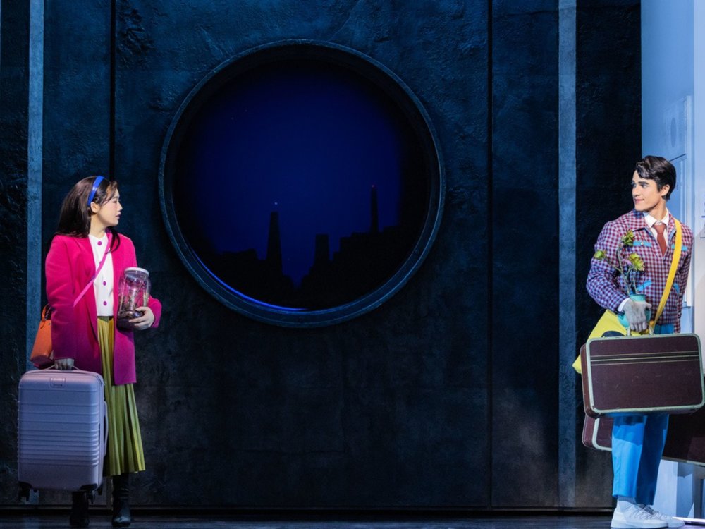 Maybe Happy Ending musical featuring two characters with luggage on stage