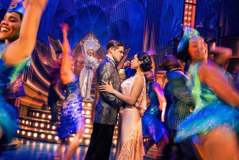 Cast of The Great Gatsby musical dancing in a dazzling 1920s party scene