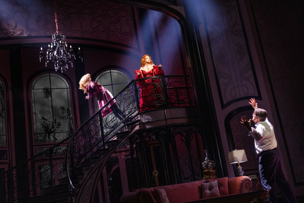 Broadway cast performing Death Becomes Her on a grand staircase set
