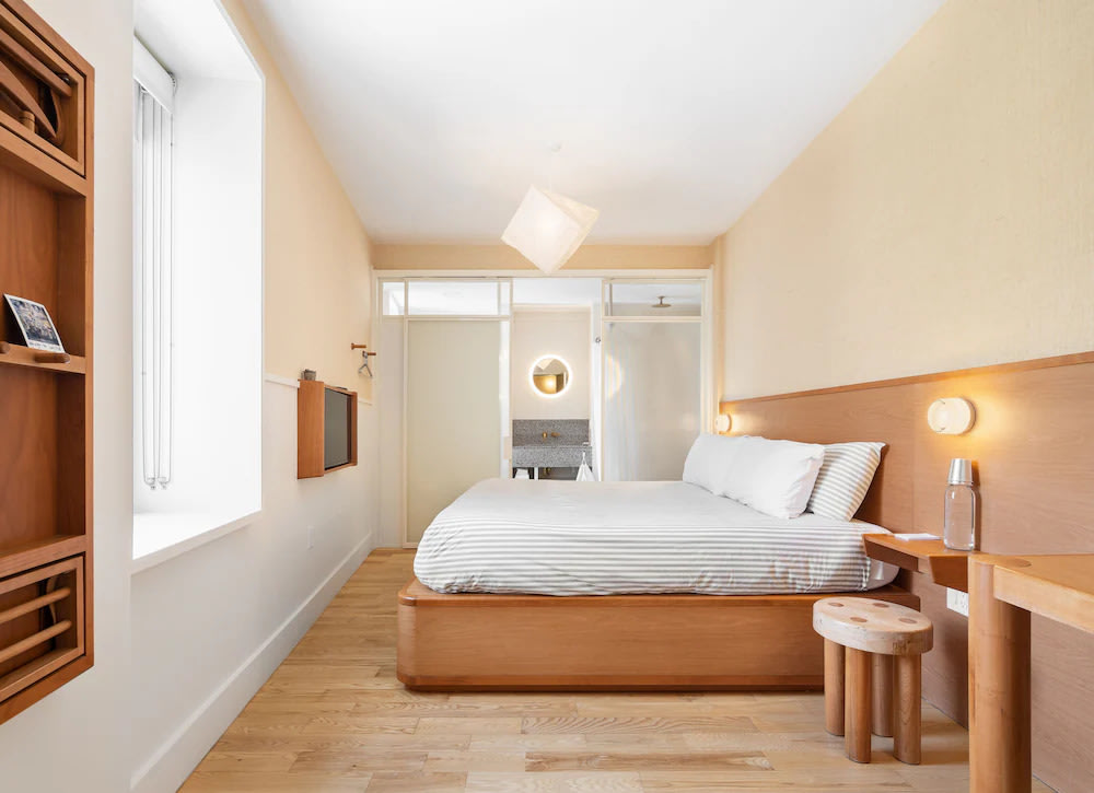 Untitled at 3 Freeman Alley’s well-designed rooms with wooden furniture and white interiors
