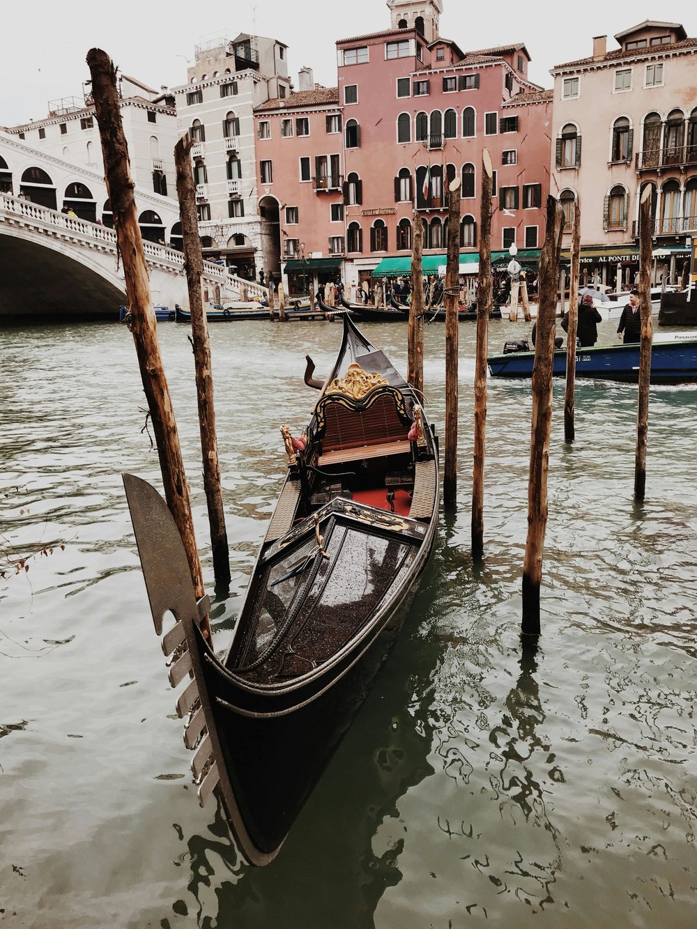 Gondola moored near Rialto Bridge on the Grand Canal in Venice