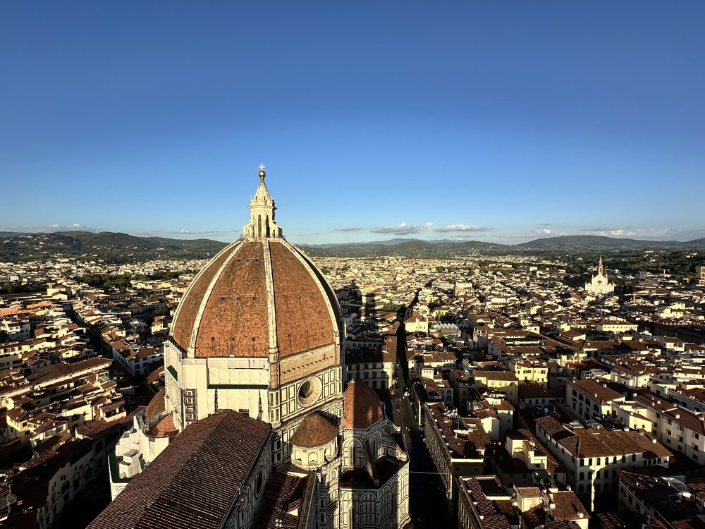 view of the Duomo in Florence at the top of the bell tower