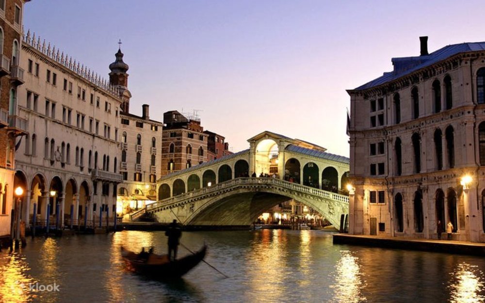 Rialto Bridge and Grand Canal at dusk in Venice, Italy