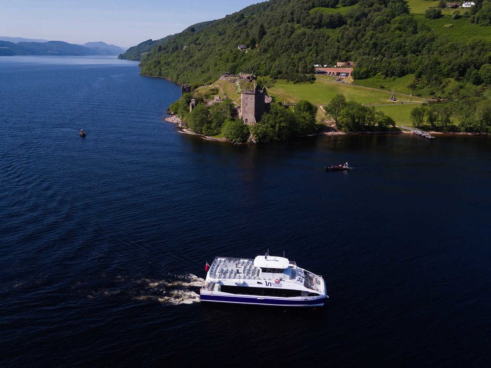 Boat cruising along Loch Ness