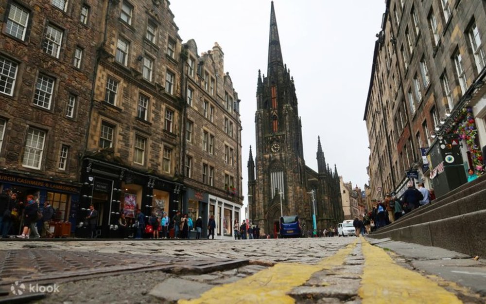 A low-angle view of Edinburgh's Royal Mile, featuring historic stone buildings