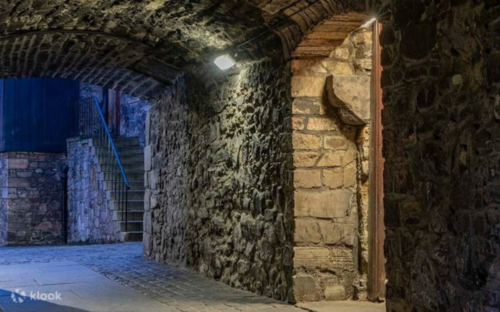 A dark, stone-walled close in Edinburgh's Old Town