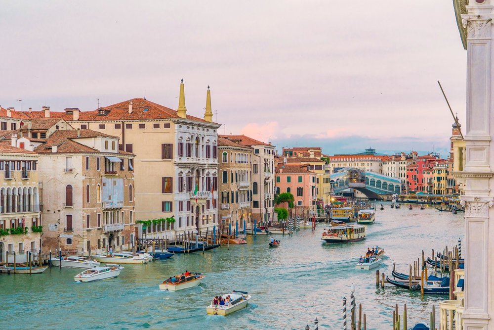  Venice’s canal alleyways and colorful buildings onboard a gondola