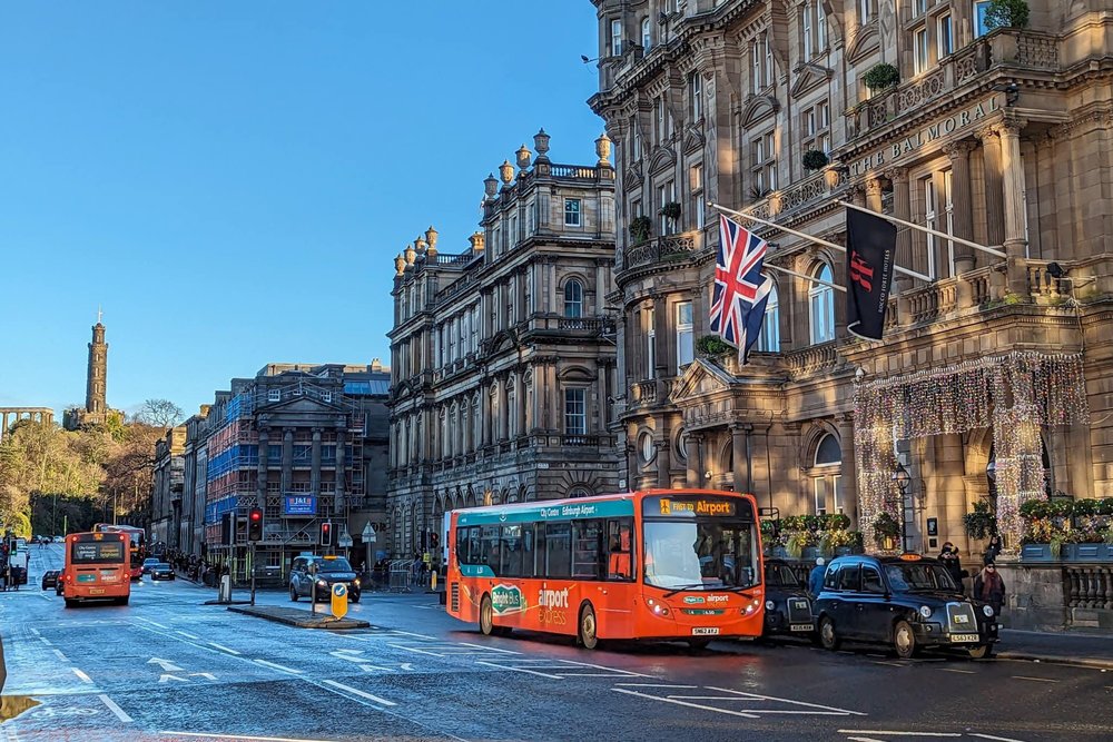 Red bus on city streets