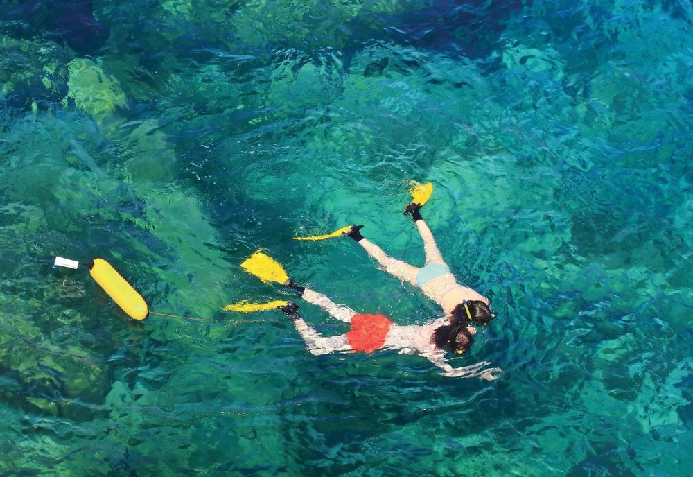 Two people snorkeling at Koh Samui beach