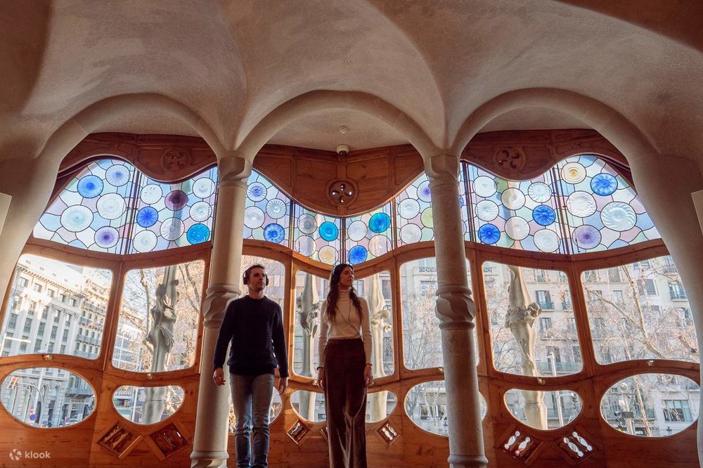 One of the rooms within Casa Batlló with stained glass windows and unique columns