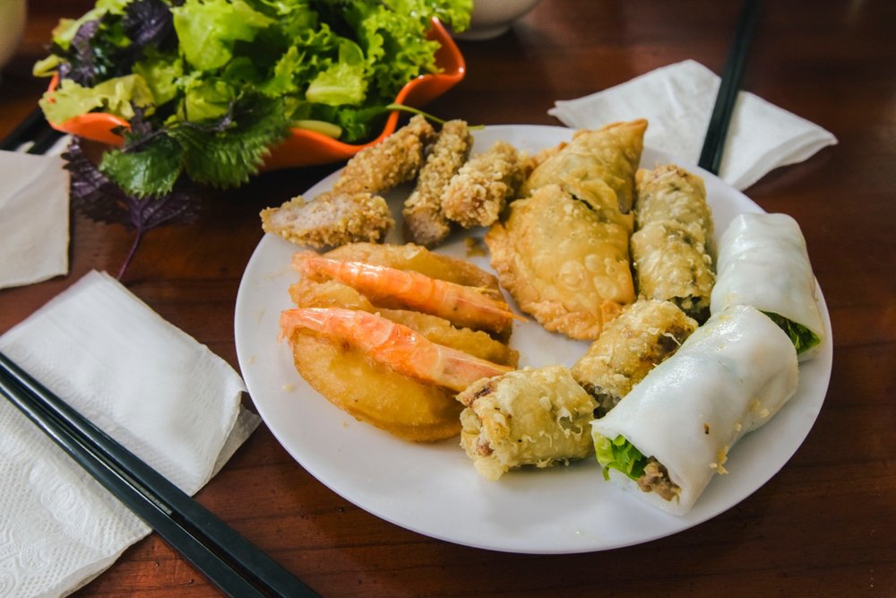 Plate of Vietnamese spring rolls and fried snacks in Hanoi Old Quarter