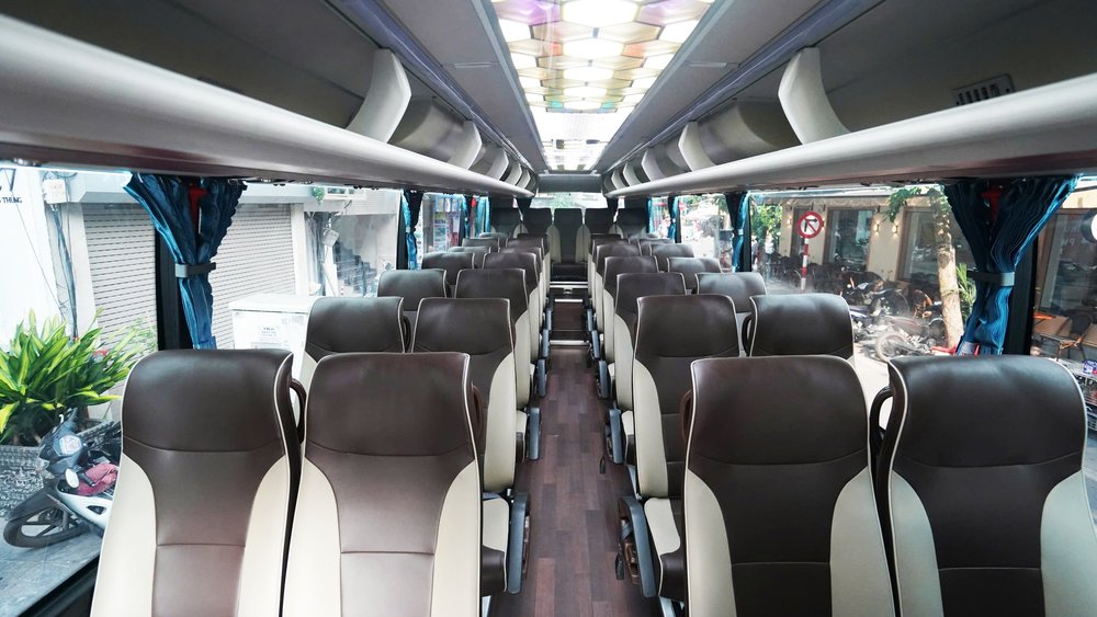 Interior of modern shuttle bus offering shared transfers from Hanoi to Halong Bay