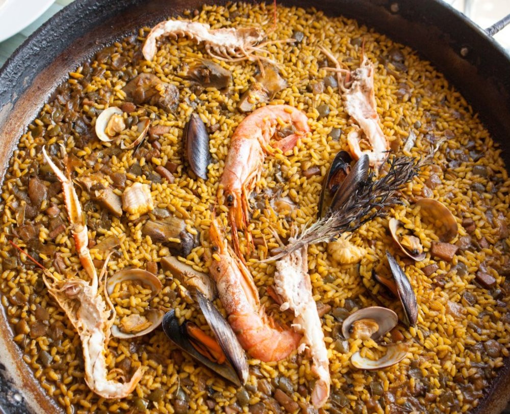 Closeup of seafood paella with shrimp and clams