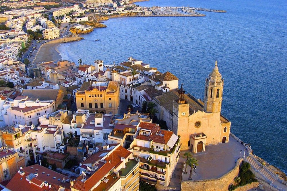 aerial view of sitges in spain overlooking the beach and cathedral