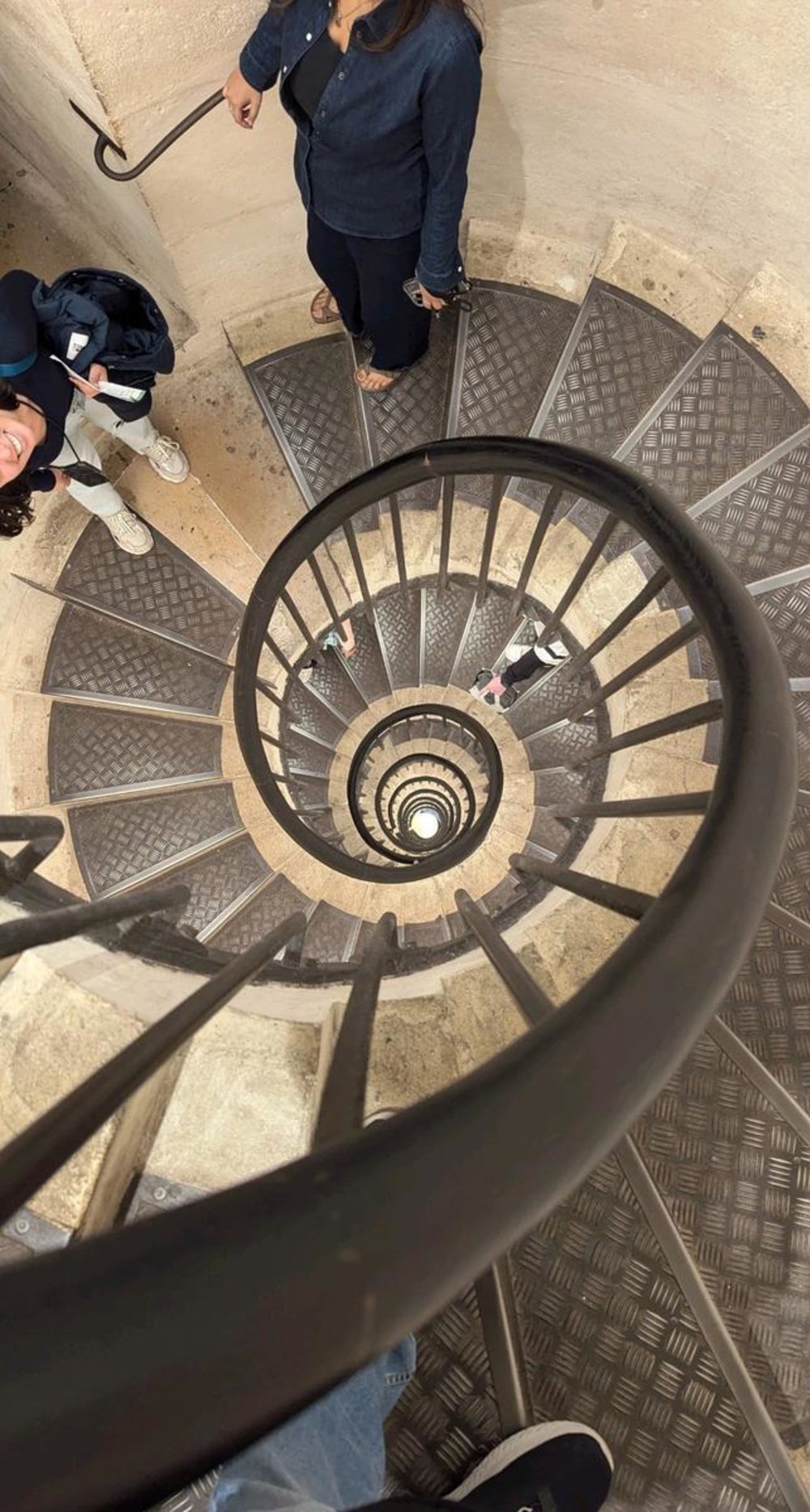 Spiral staircase inside the Arc de Triomphe leading to the rooftop view