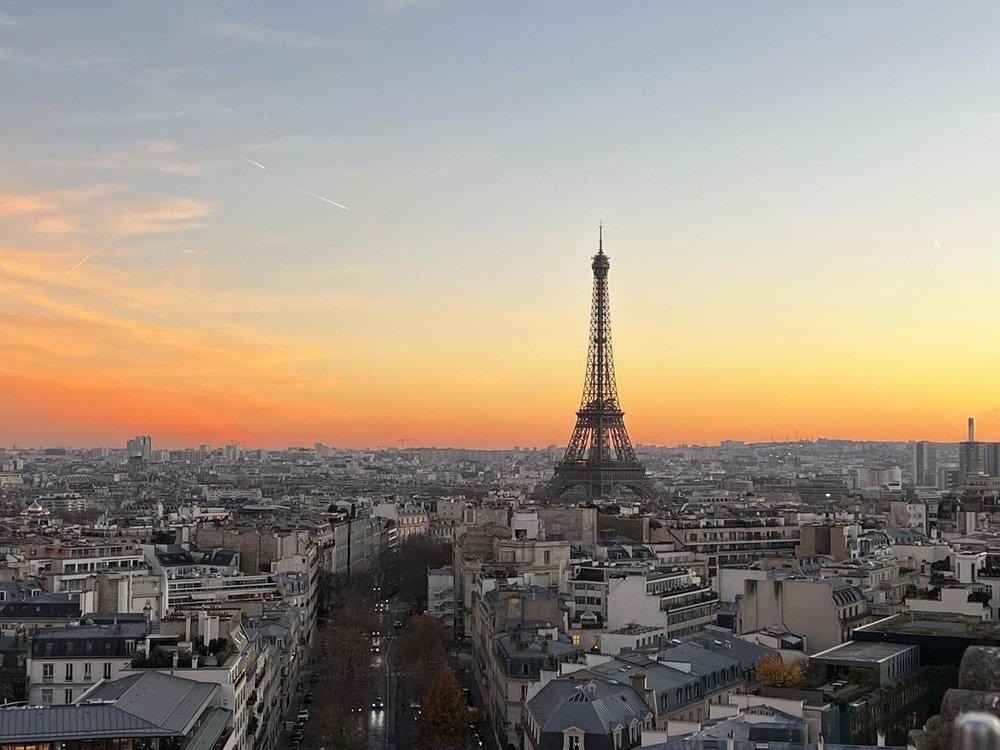 Eiffel Tower at sunset seen from the top of the Arc de Triomphe in Paris