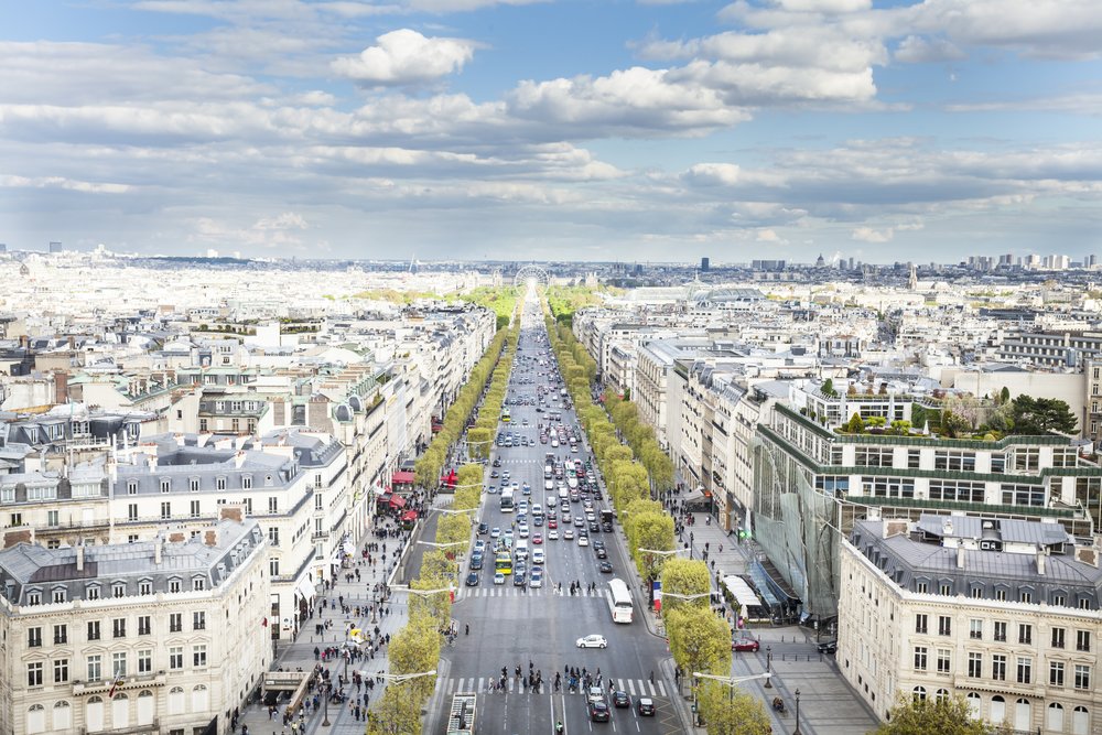 Top view of the Champs-Élysées lined with trees and shops in Paris