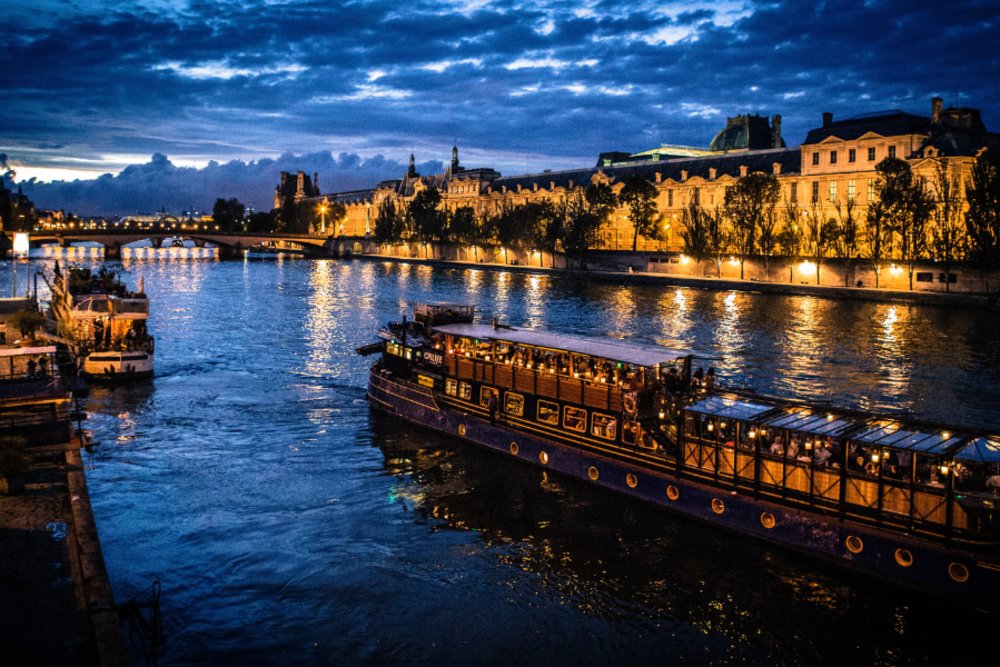 Night river cruise on the Seine in Paris, France