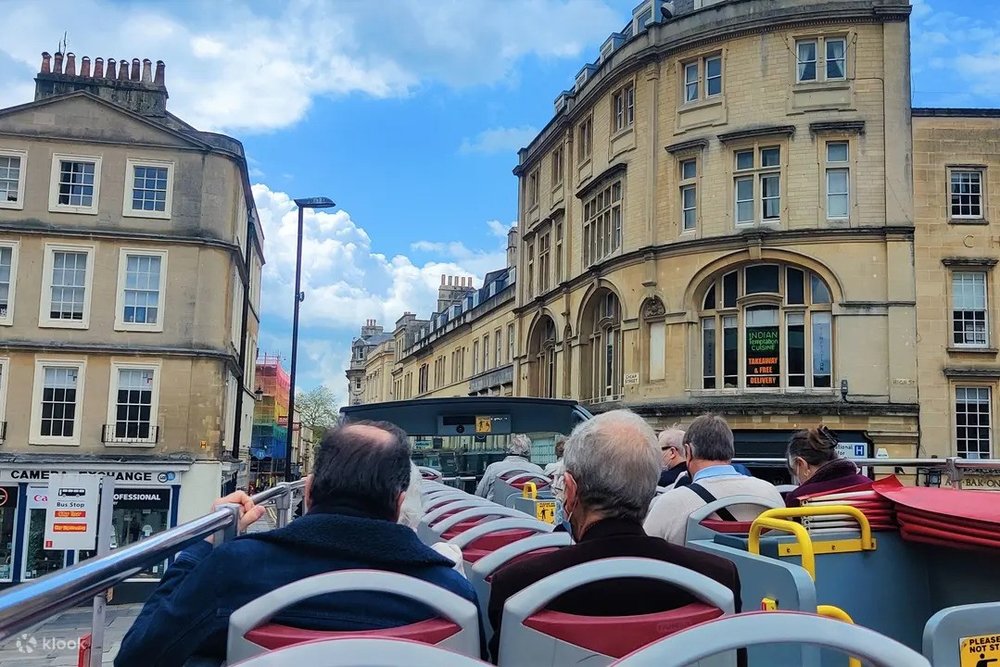 Travelers sightseeing on Bath’s Hop-On Hop-Off double-decker bus
