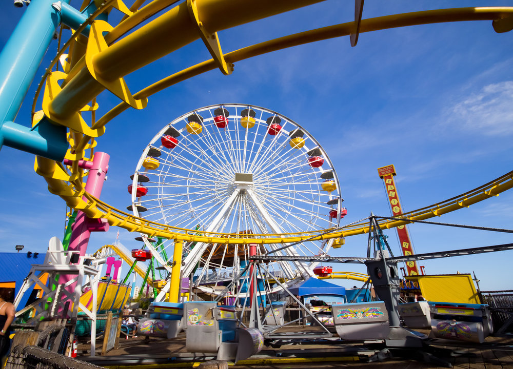 Pacific Park Ferris wheel and roller coaster rides on Santa Monica Pier.