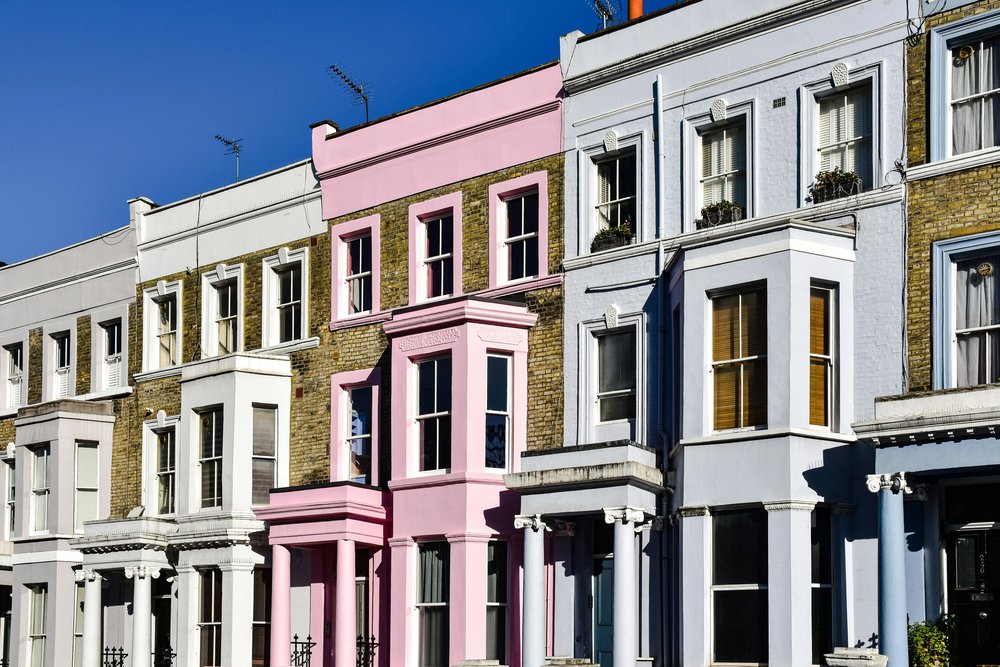 A row of colorful terraced houses in Notting Hill, London