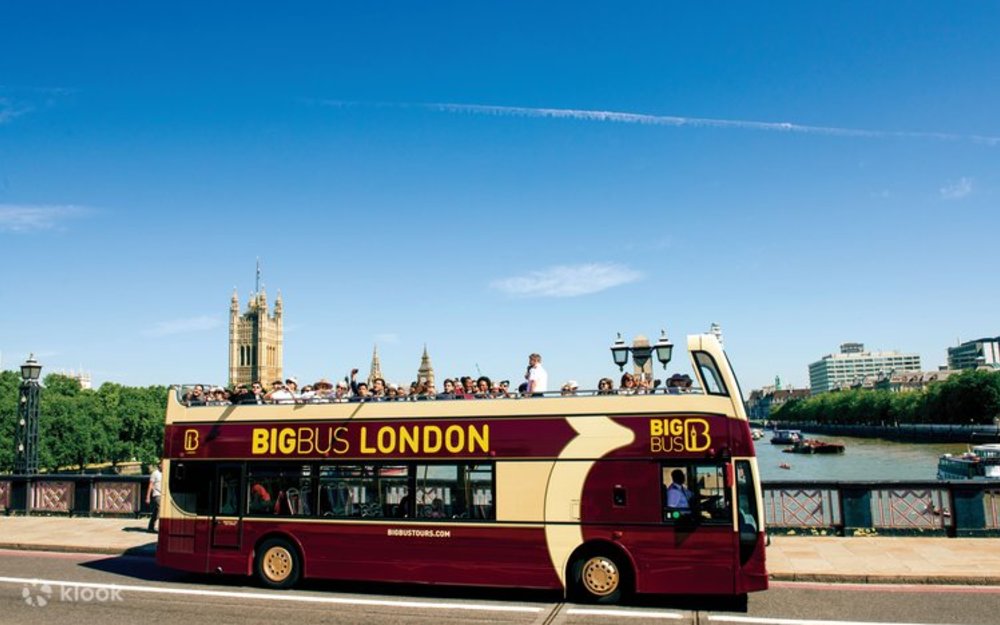 A Big Bus Tours London double-decker bus, full of passengers