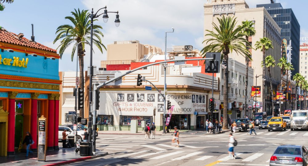 Tourists walking and cars driving along Hollywood Boulevard, Los Angeles