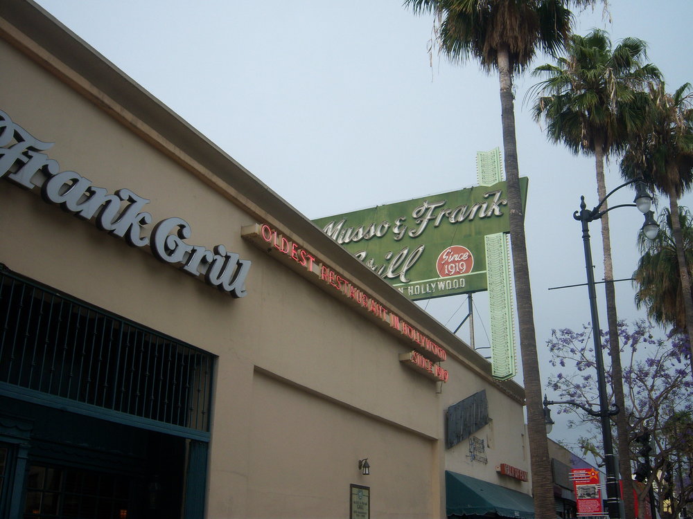 Exterior of Musso & Frank Grill with vintage neon sign in Hollywood