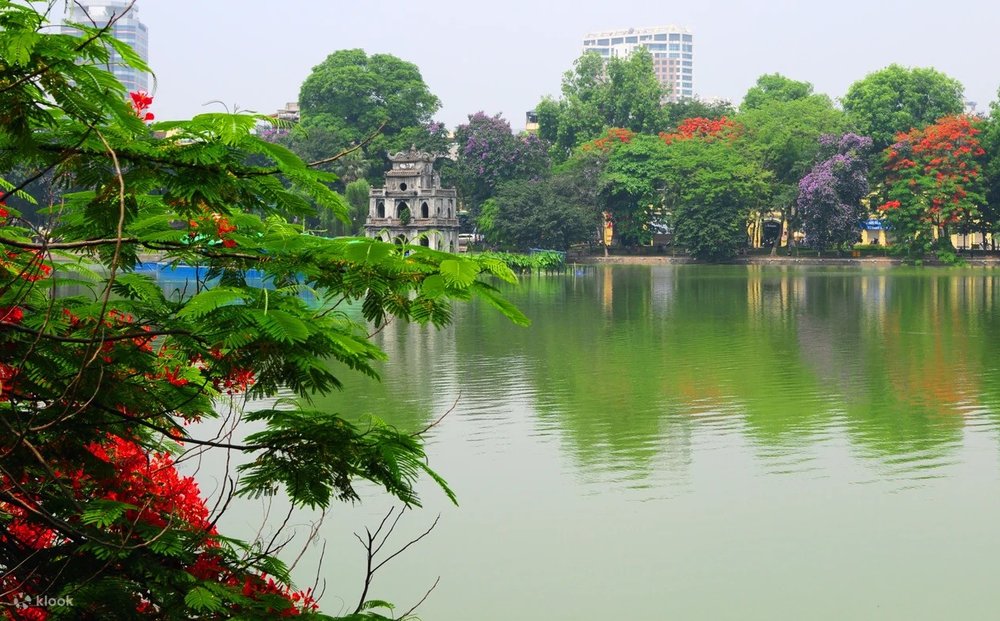 Turtle Tower peeking through Hoàn Kiếm Lake in Hanoi, Vietnam
