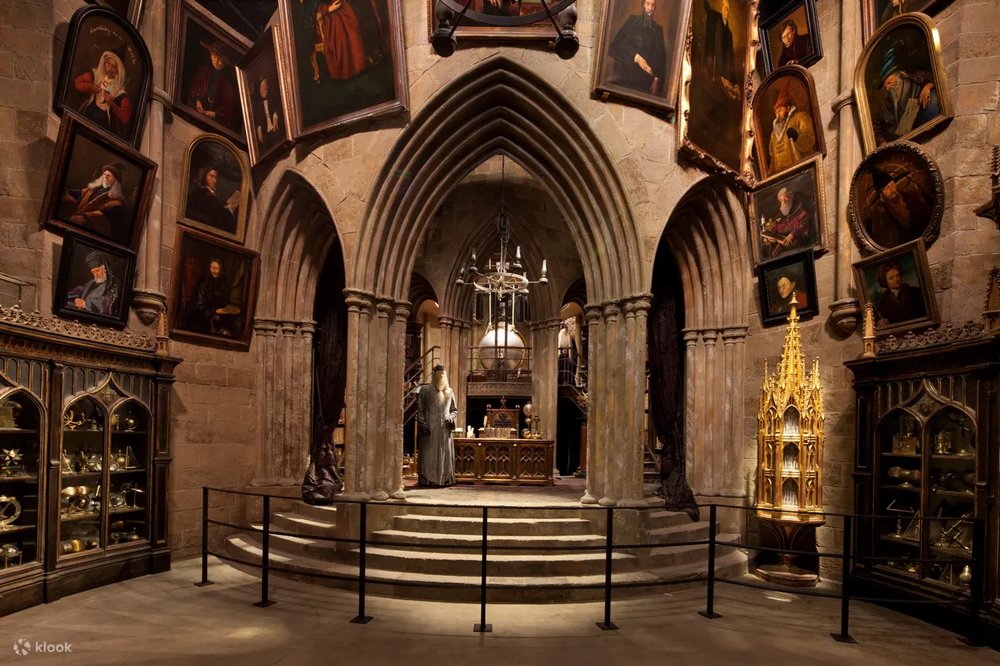 Inside Dumbledore’s office, filled with paintings and magical artifacts