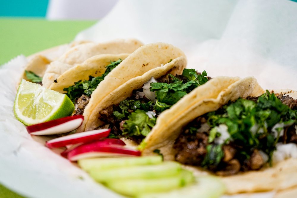 Beef tacos with lime and radish