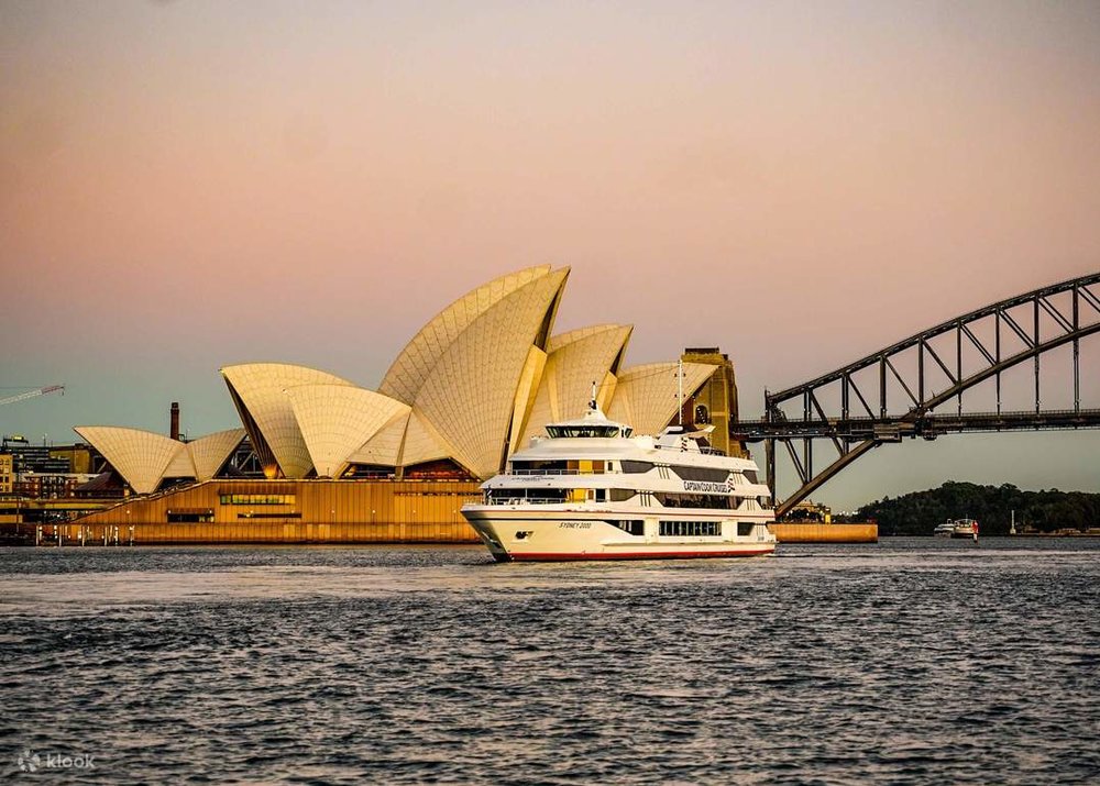 Sunset views of Sydney Harbour Bridge and Sydney Opera House.