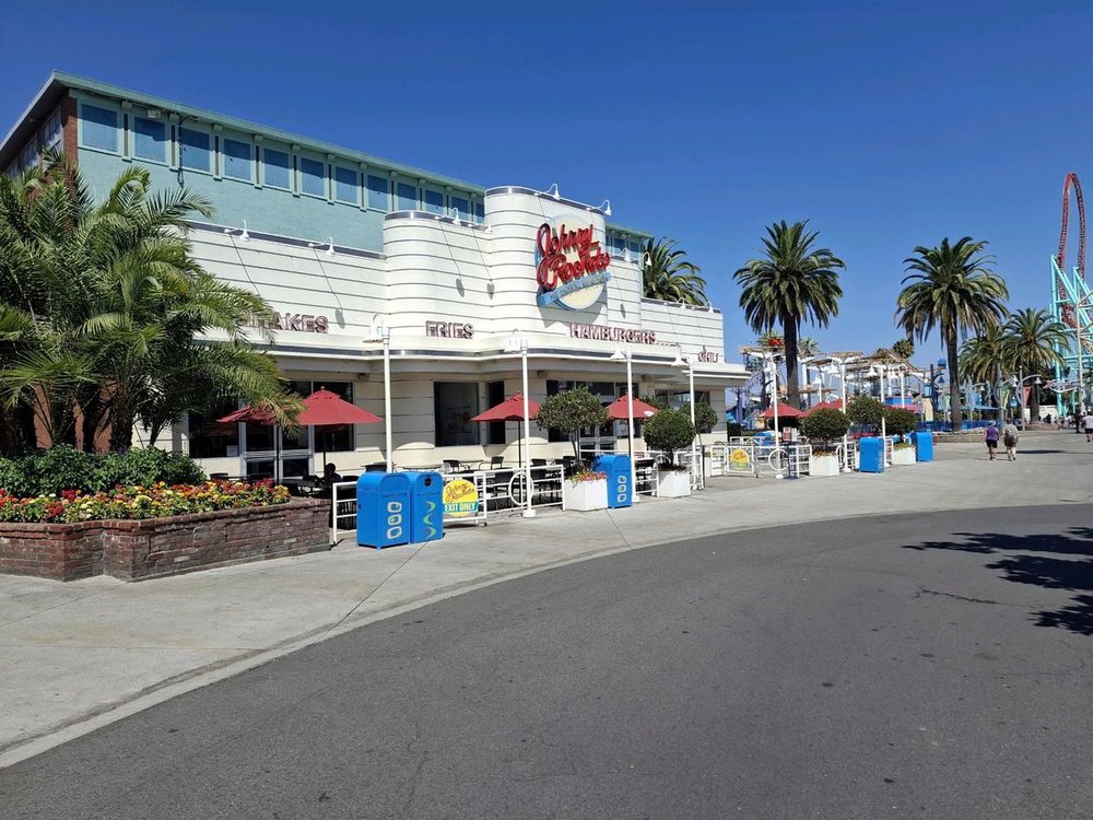 Johnny Rockets restaurant exterior at Knott’s Berry Farm with outdoor seating.