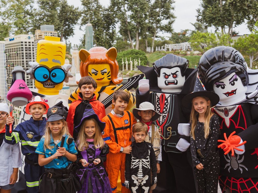 Children in costumes with LEGO Halloween characters at LEGOLAND California.