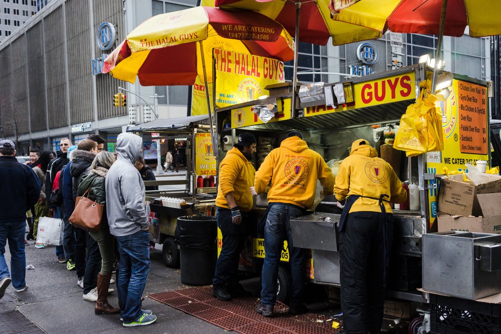 People lined up at The Halal Guys stall