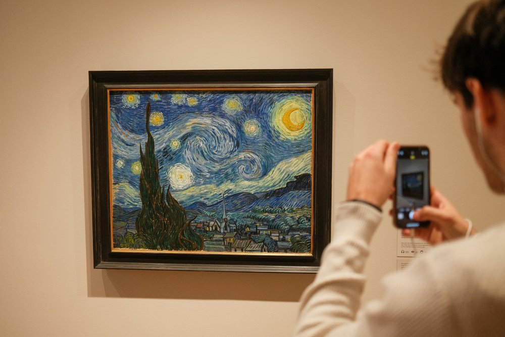Taking a photo of the Starry Night painting