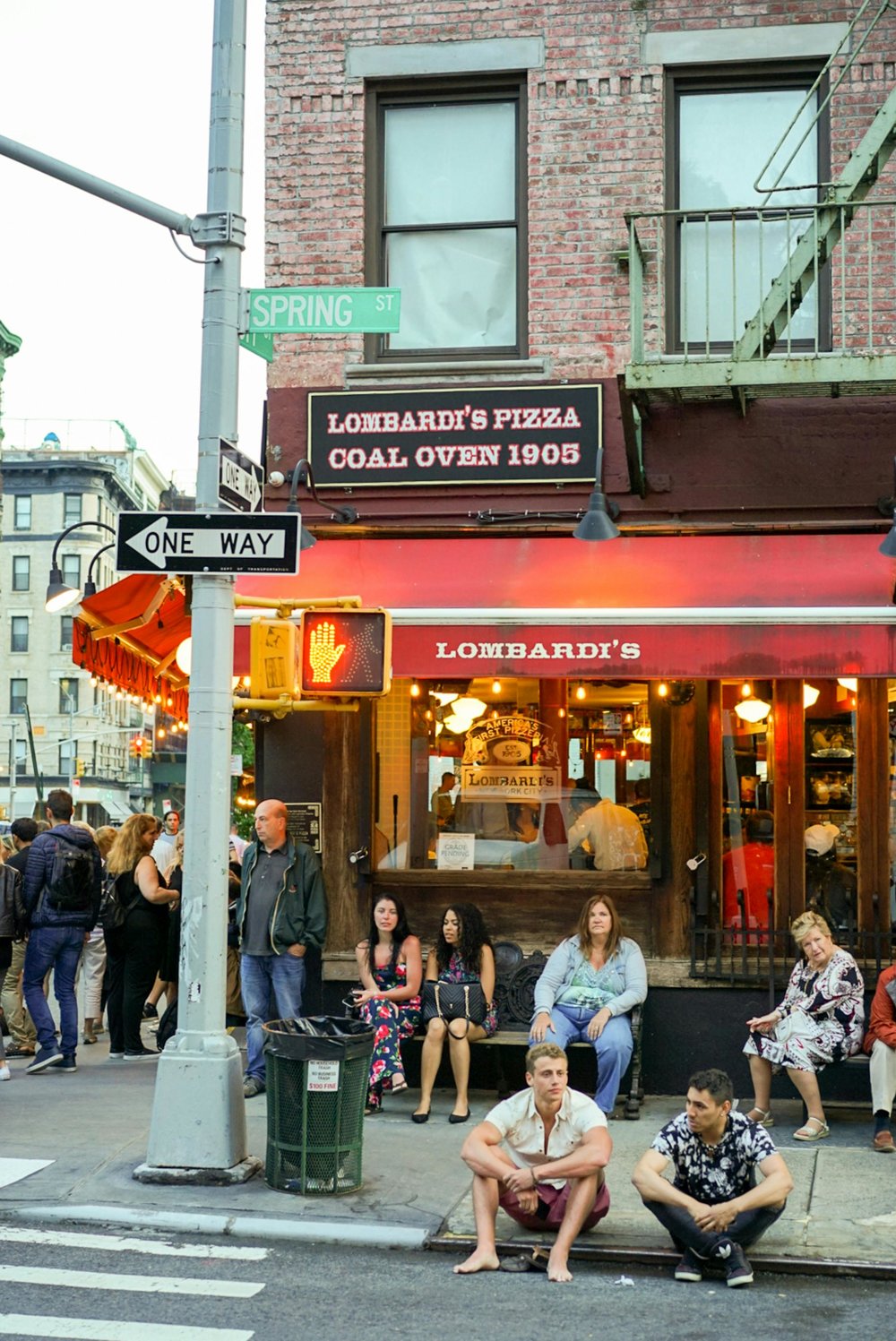 People waiting outside Lombardi’s Pizza on Spring Street, New York.
