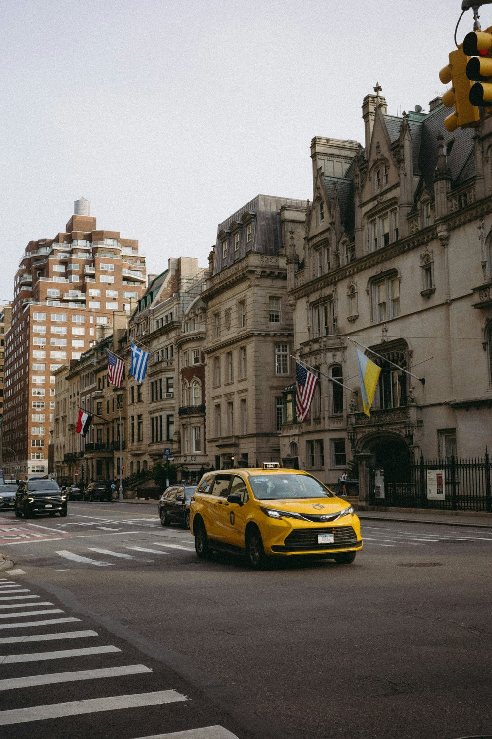 Classic yellow taxis along a street in the Upper East Side
