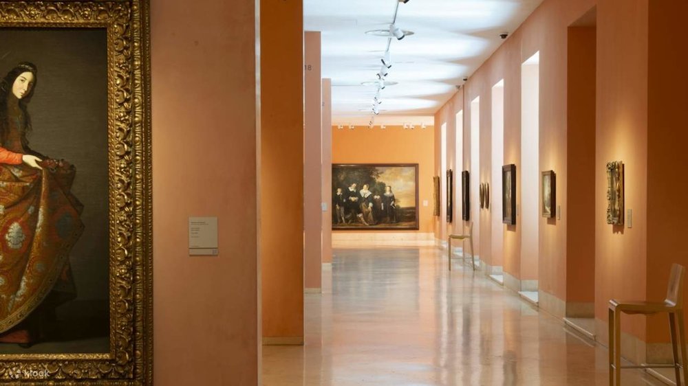 Interior hallway of the Thyssen, lined with paintings
