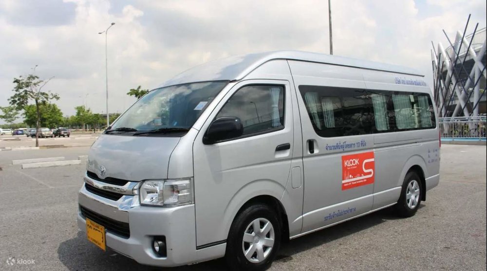 A standard van parked in a parking lot