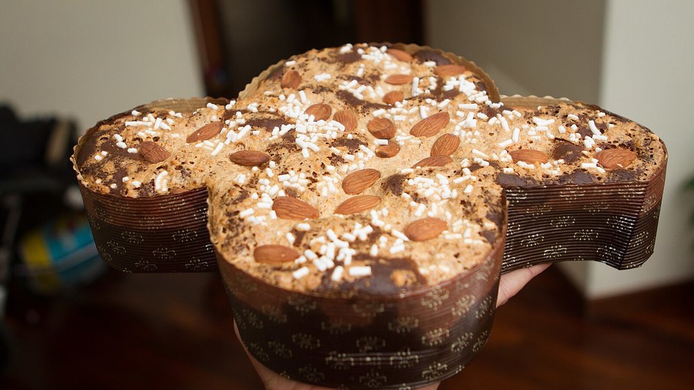 Close-up of a Colomba Easter cake with almonds and sugar on top