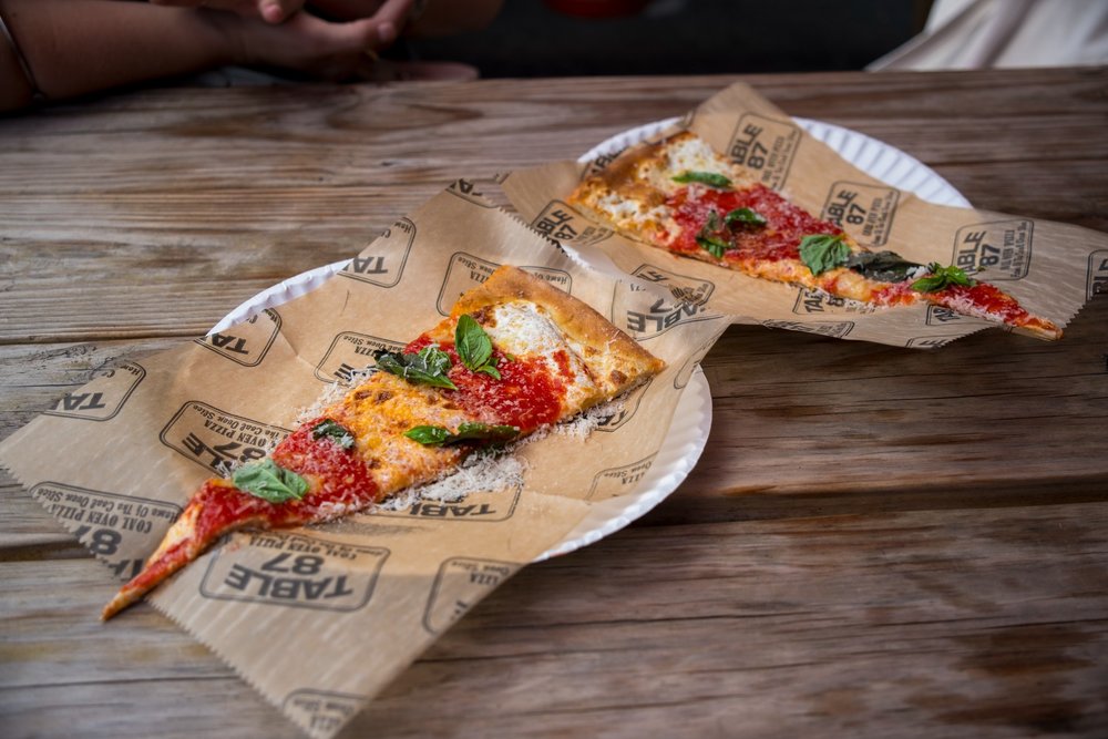 Two slices of pizza on a table