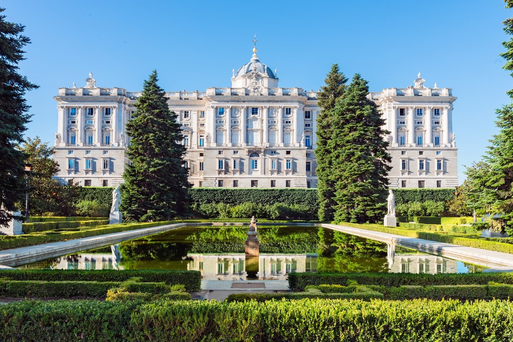 Official Spanish royal residence with grand halls, frescoes, and historical artifacts.