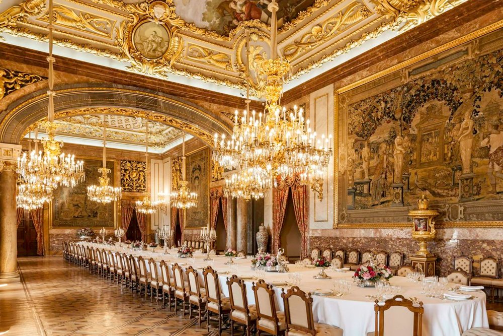 Opulent Royal Palace dining hall with chandeliers and gold décor