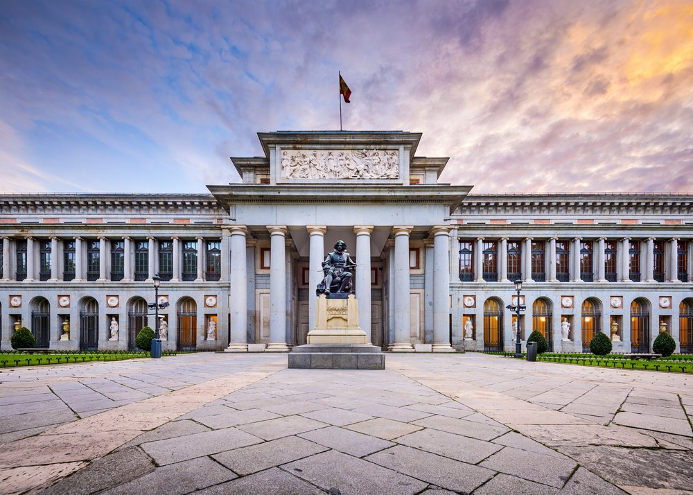 Front view of the Prado Museum with Velázquez statue in Madrid