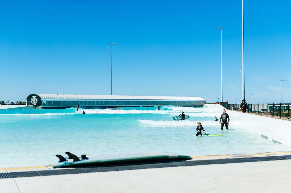 Kids and adults learning to surf at URBNSURF